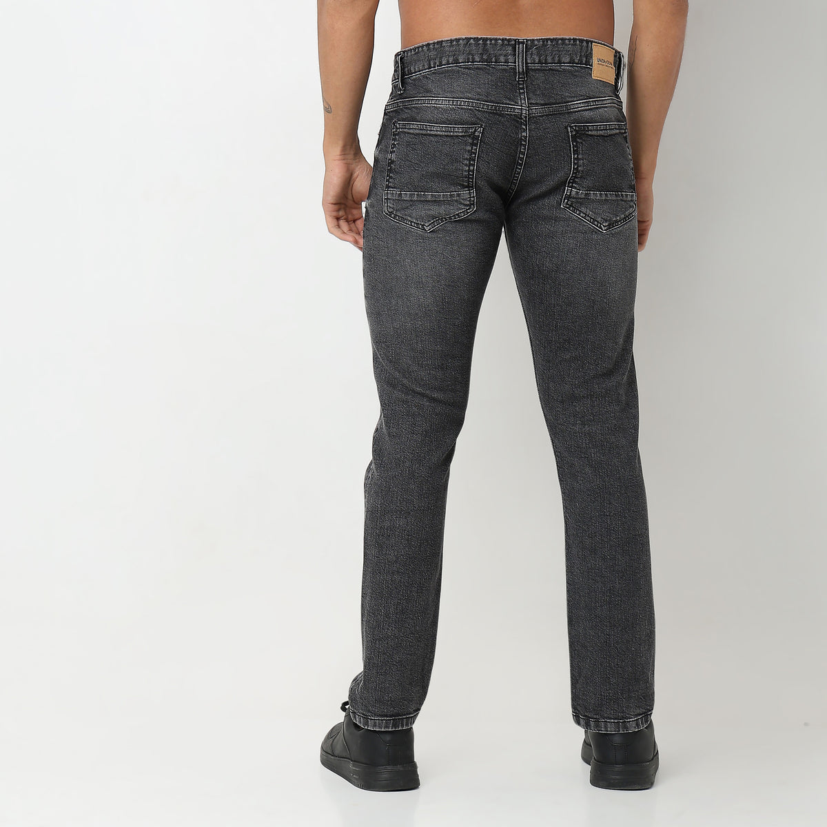 Tapered Fit Solid Mid Rise Jeans