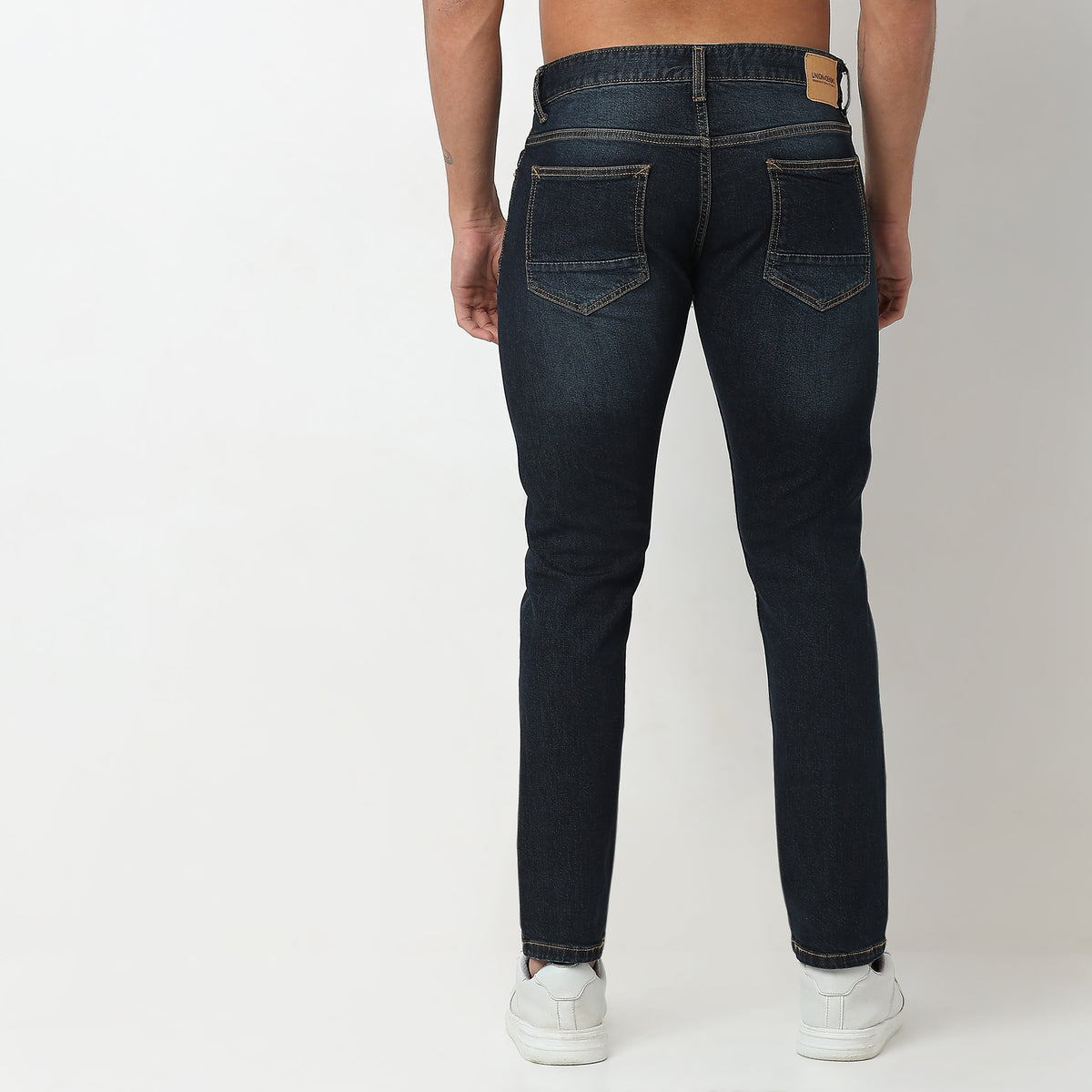 Tapered Fit Solid Mid Rise Jeans