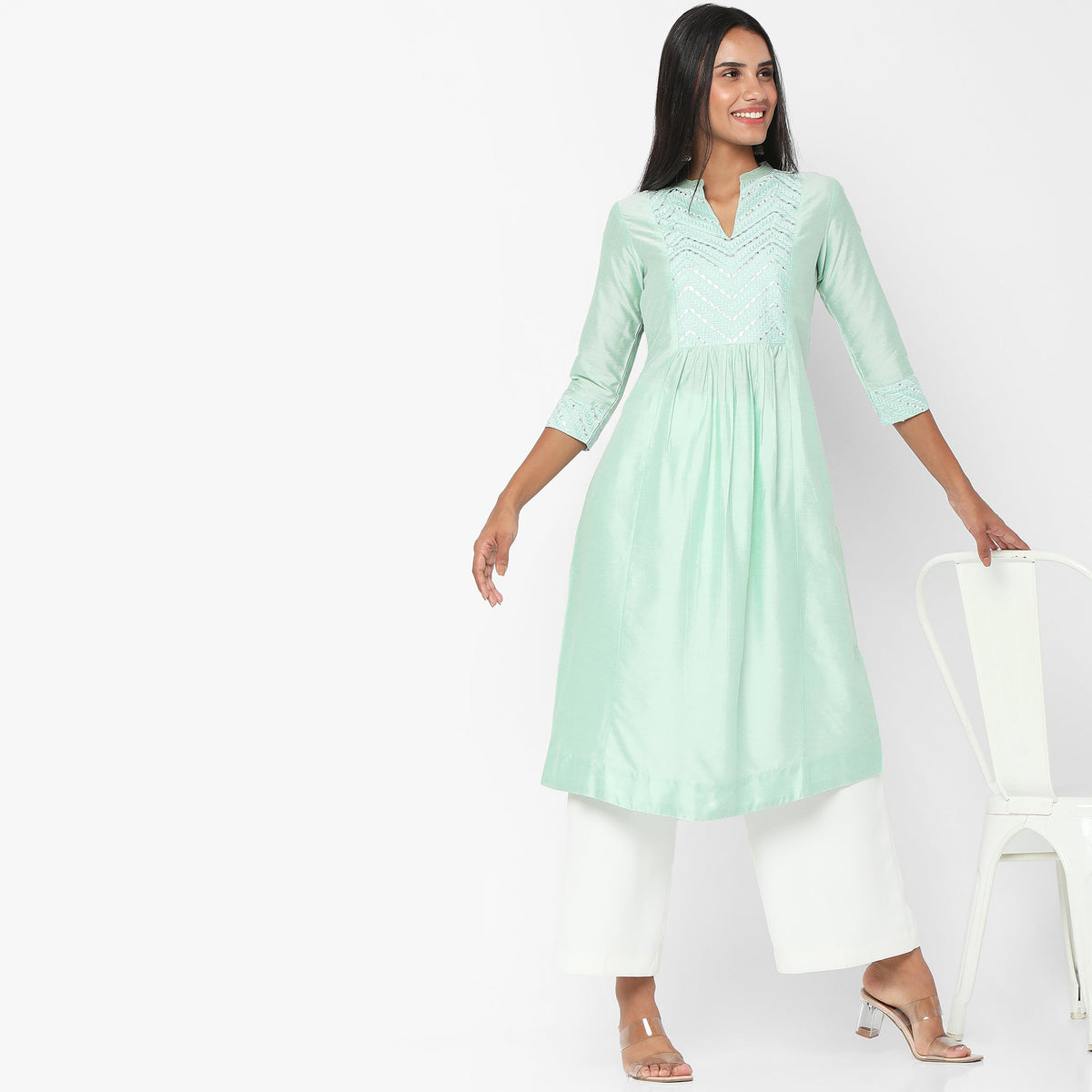 Women Wearing Regular Fit Embroidered Kurta