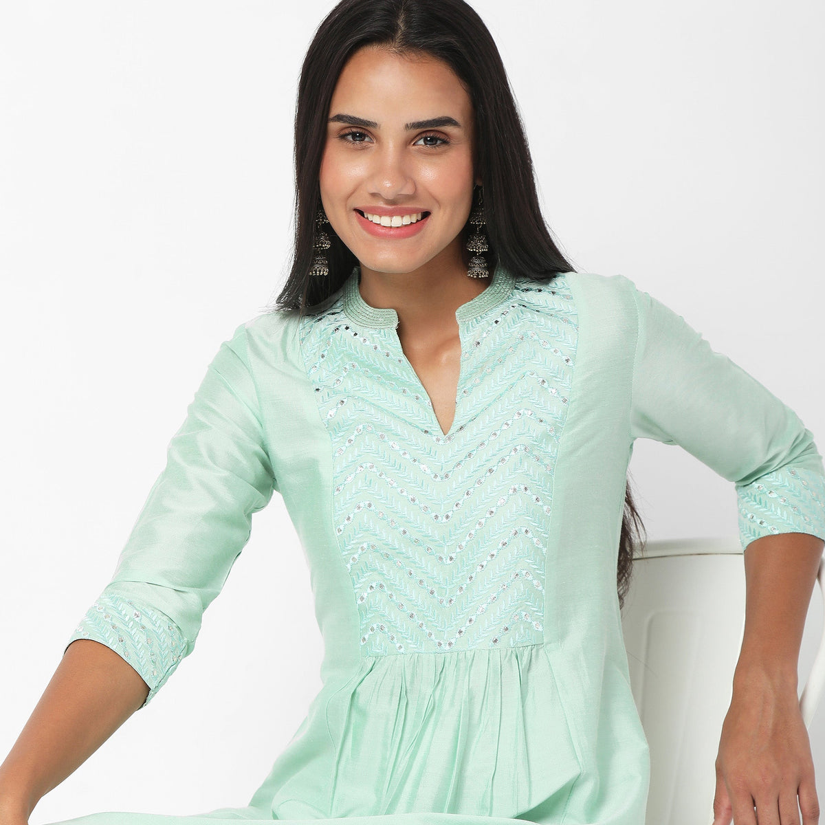 Women Wearing Regular Fit Embroidered Kurta