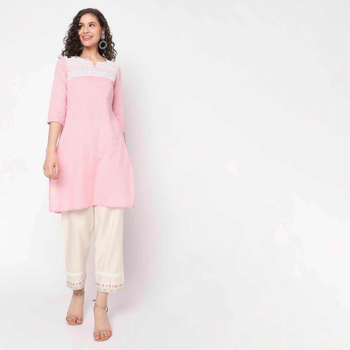 Women Wearing Straight Fit Embroidered Kurta