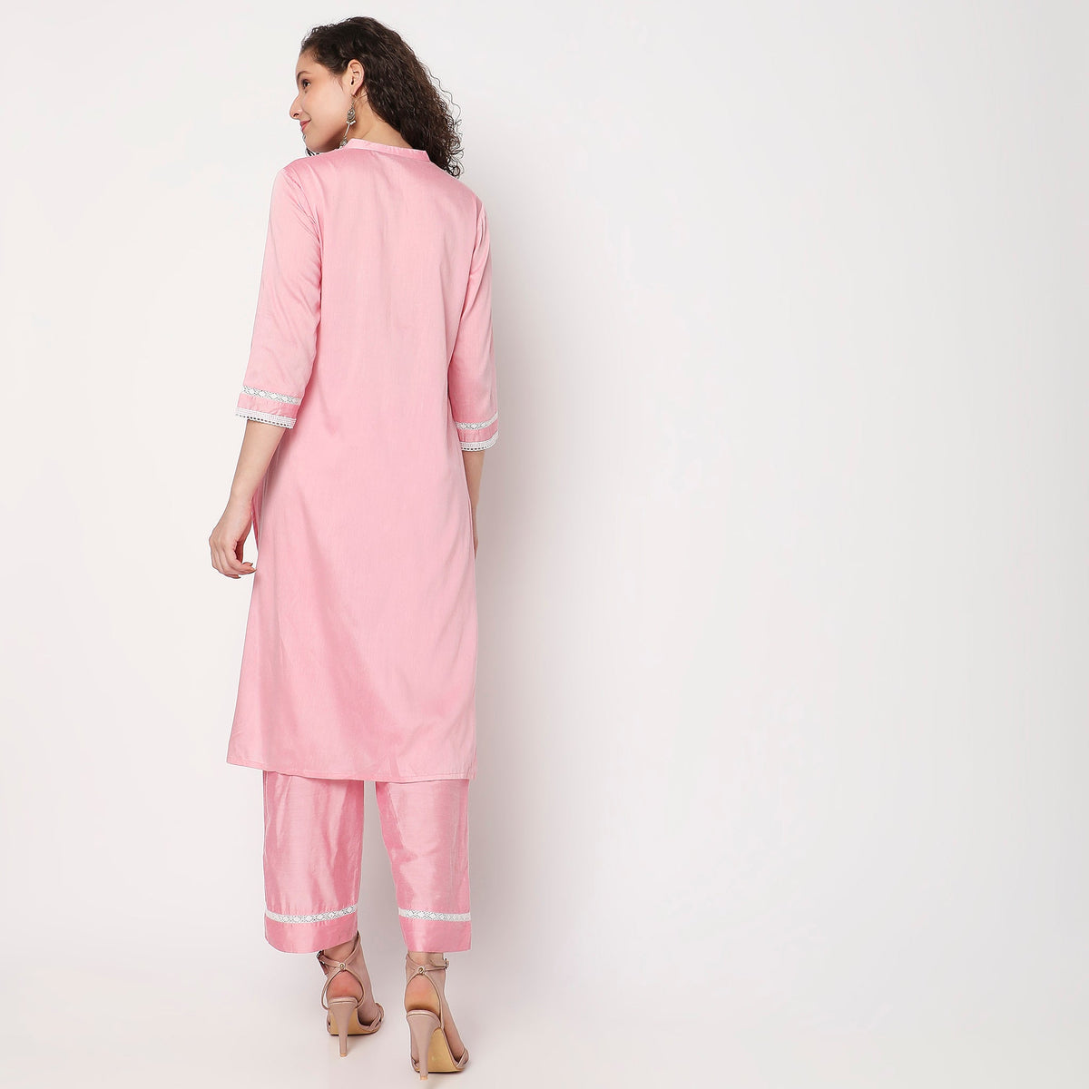 Women Wearing Straight Fit Embroidered Kurta