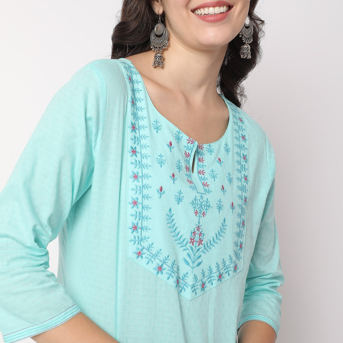 Women Wearing Straight Fit Embroidered Kurta