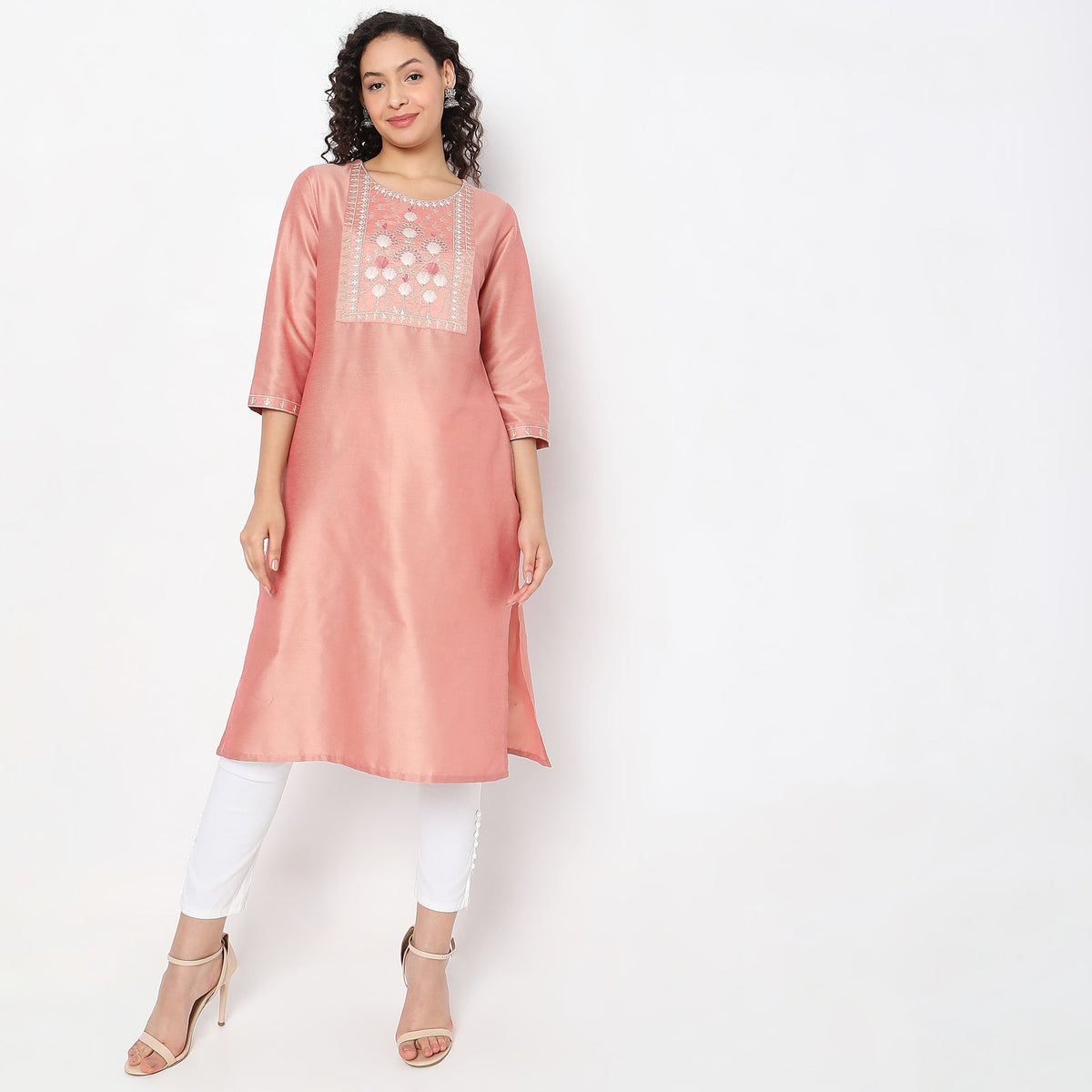 Women Wearing Straight Fit Solid Kurta