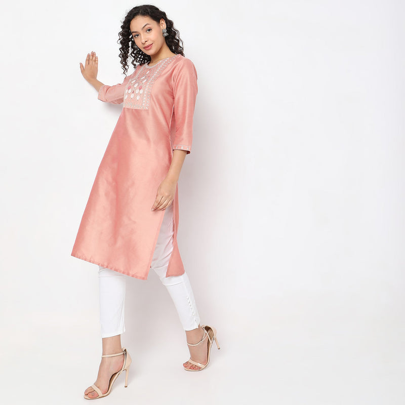 Women Wearing Straight Fit Solid Kurta