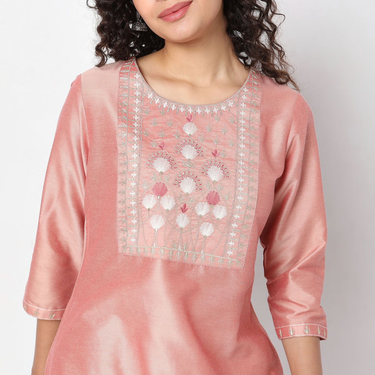 Women Wearing Straight Fit Solid Kurta