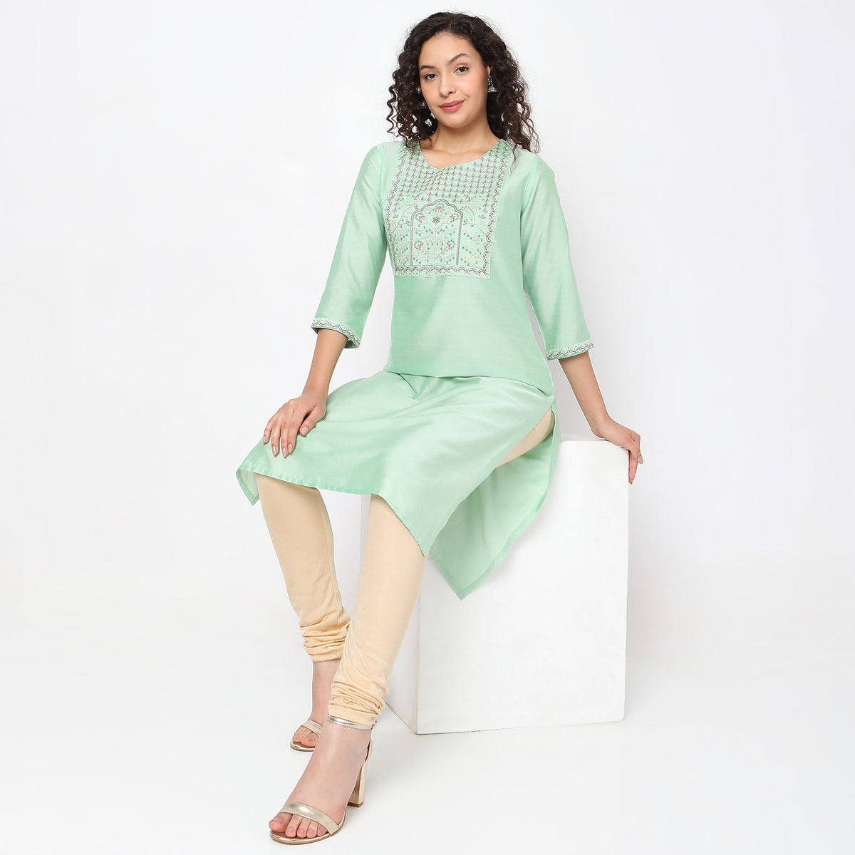 Women Wearing Straight Fit Solid Kurta