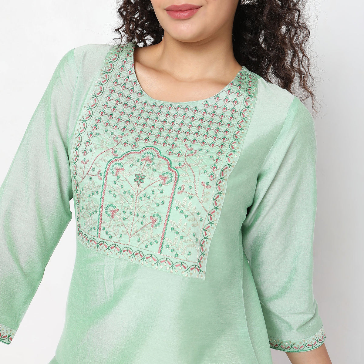 Women Wearing Straight Fit Solid Kurta