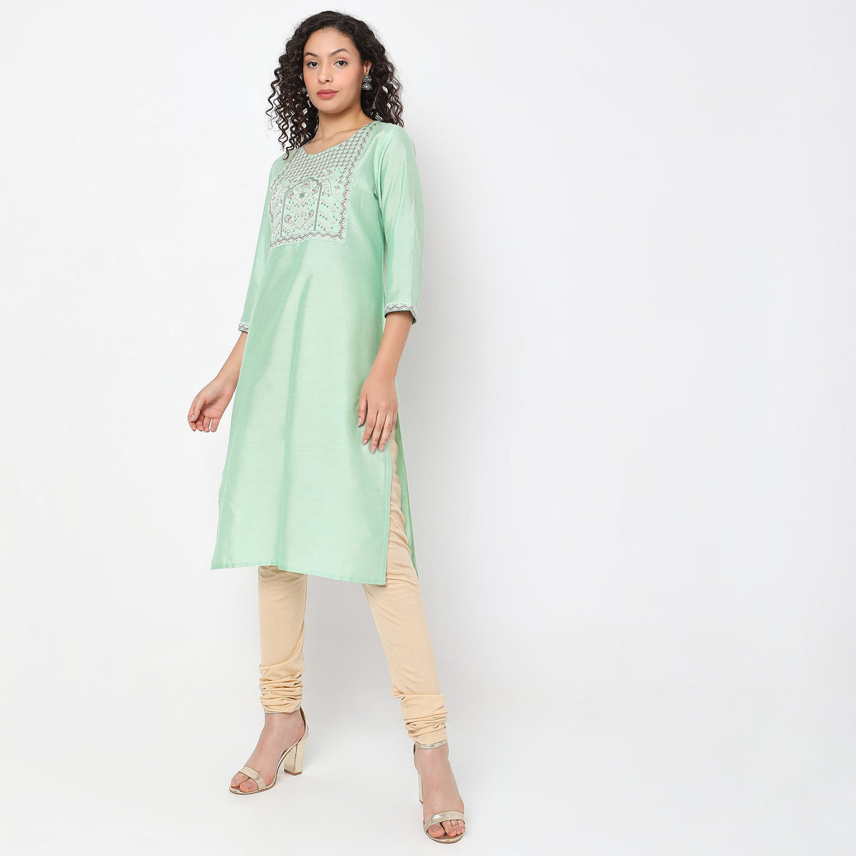 Women Wearing Straight Fit Solid Kurta