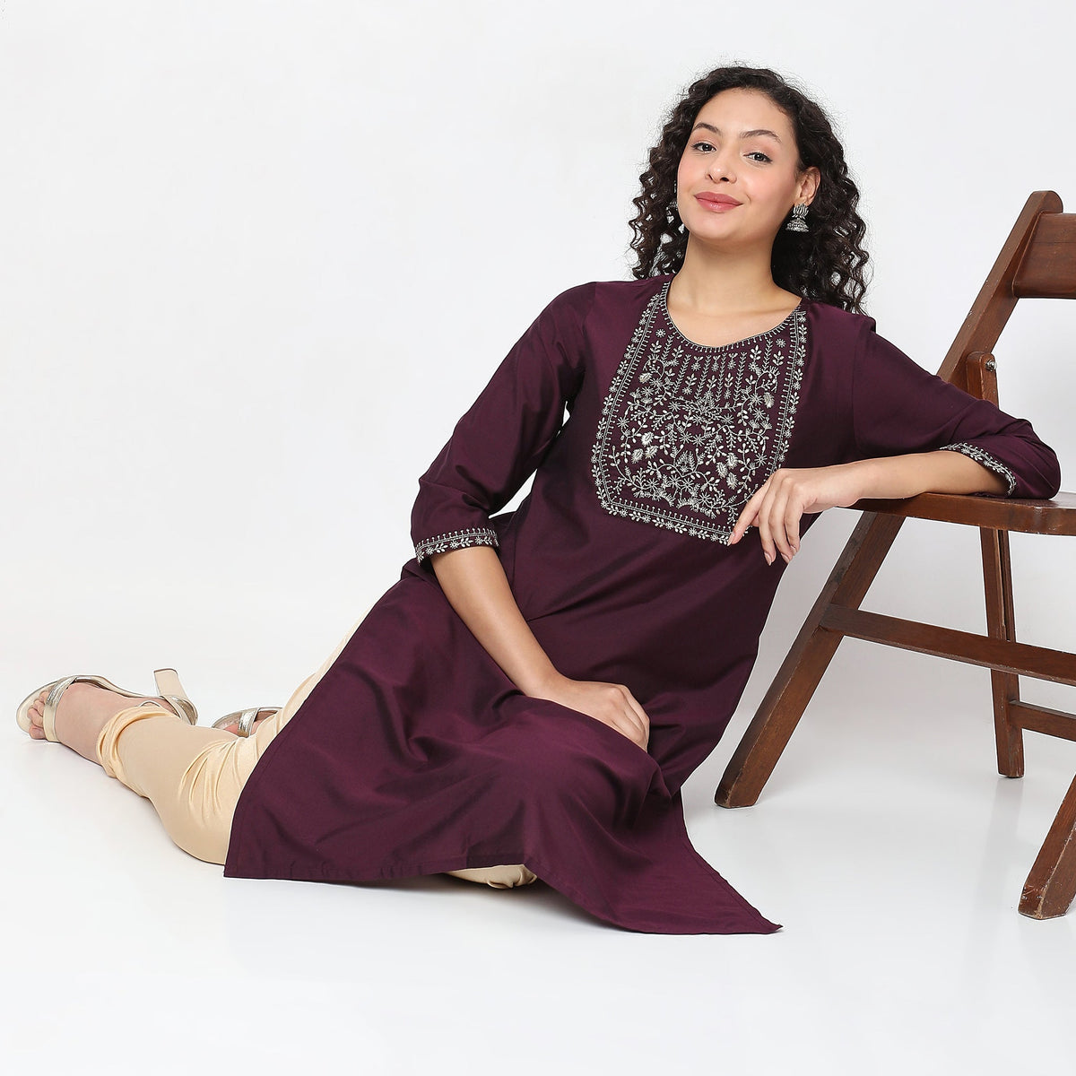 Women Wearing Straight Fit Solid Kurta