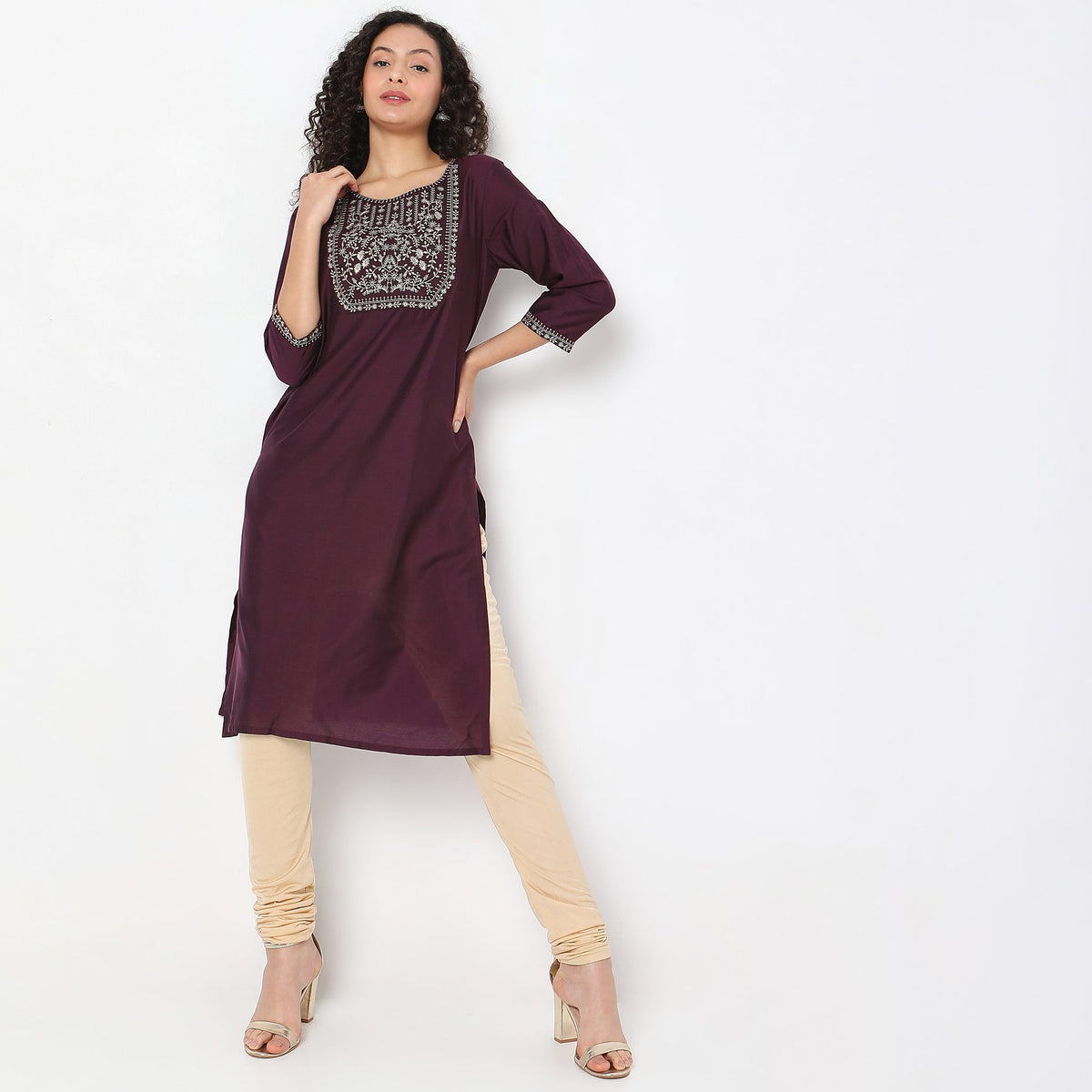 Women Wearing Straight Fit Solid Kurta