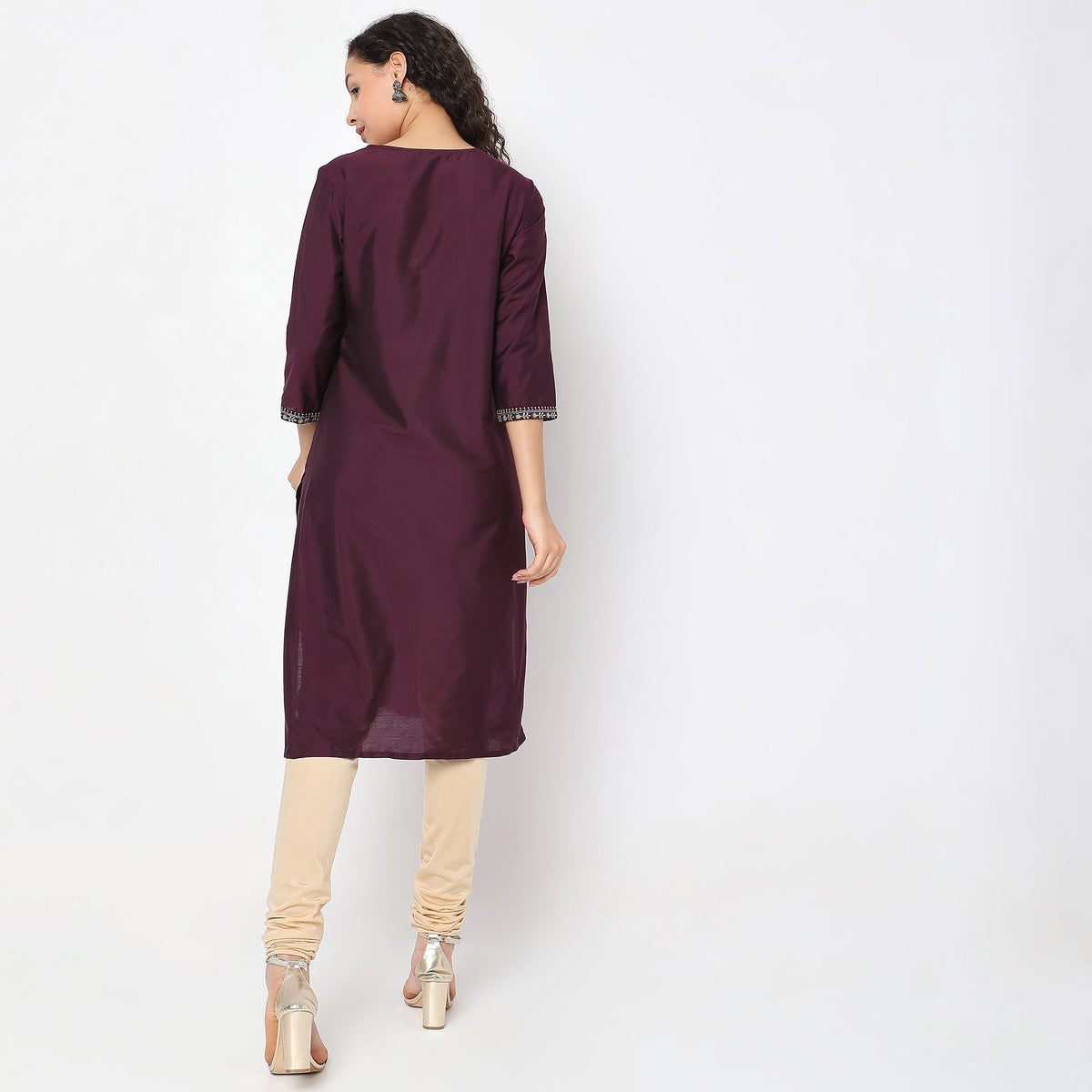 Women Wearing Straight Fit Solid Kurta