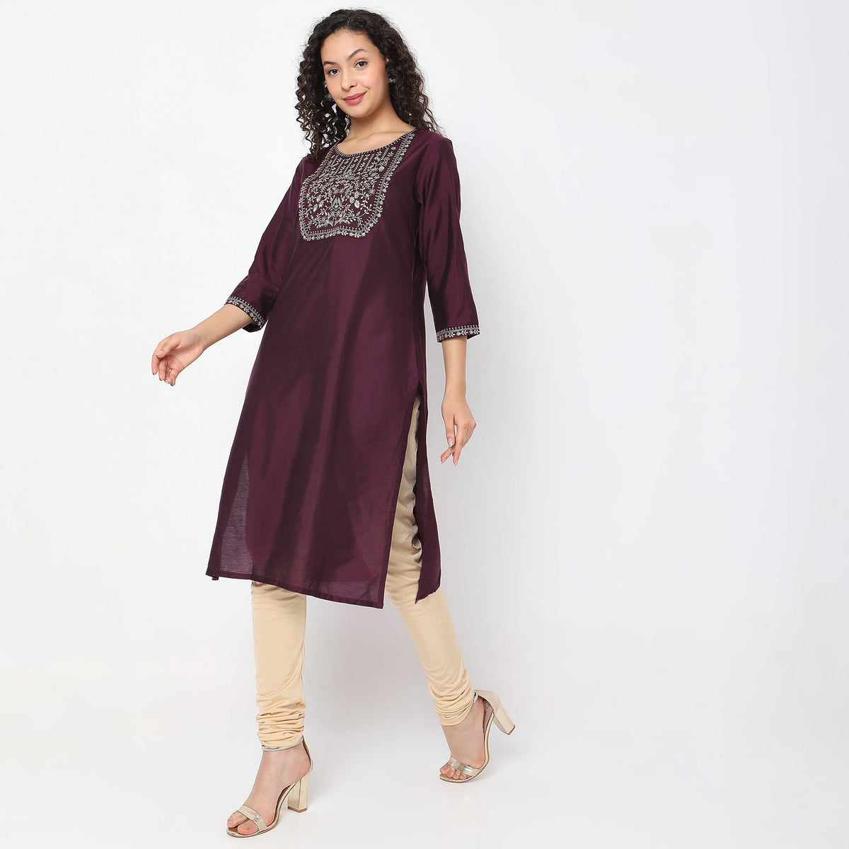 Women Wearing Straight Fit Solid Kurta