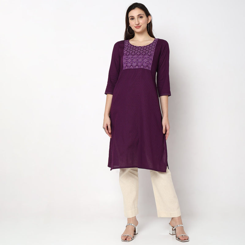 Women Wearing Straight Fit Solid Kurta