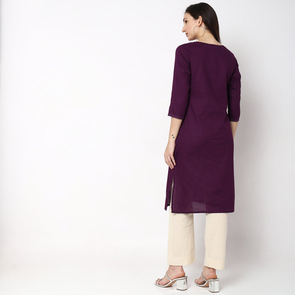 Women Wearing Straight Fit Solid Kurta