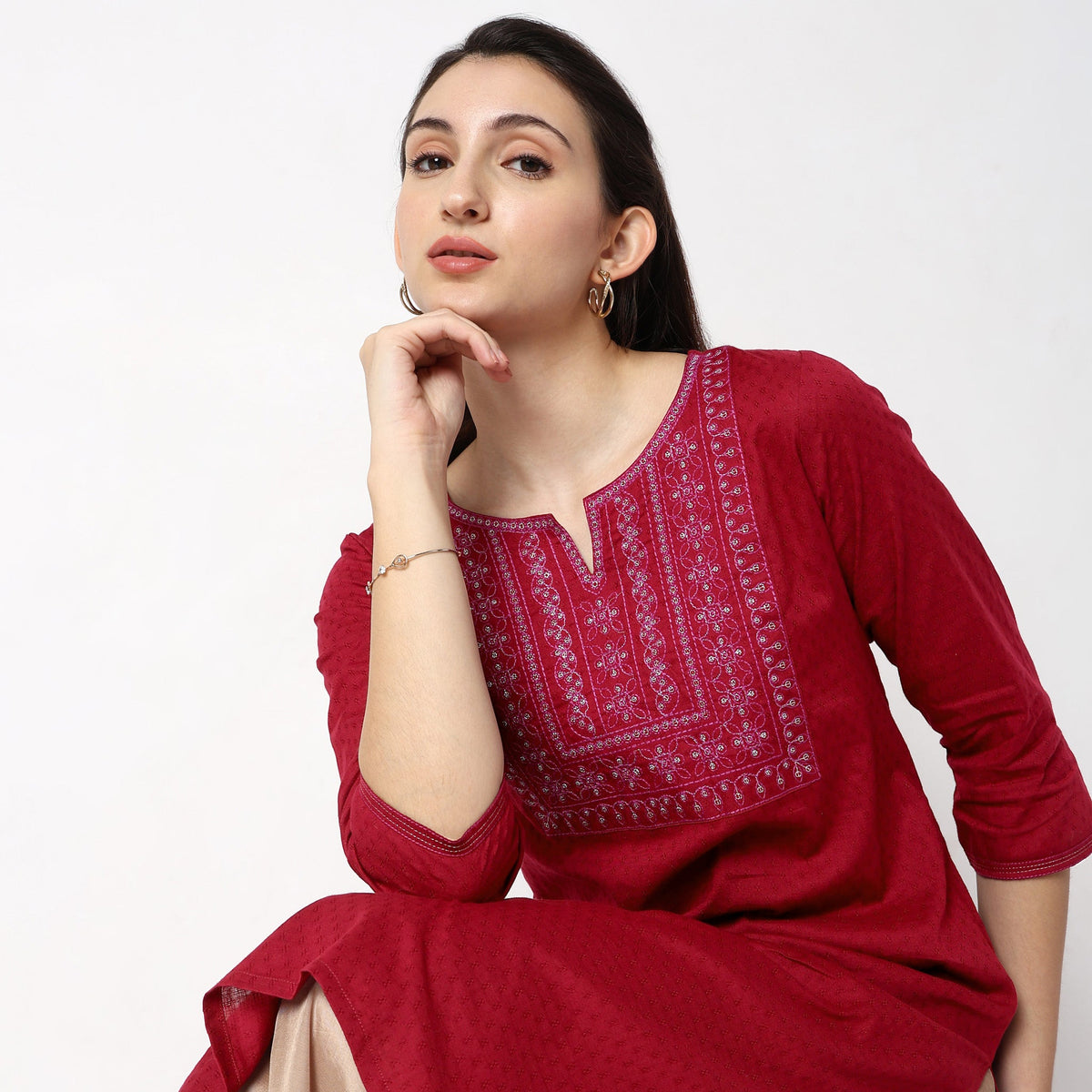 Women Wearing Straight Fit Solid Kurta