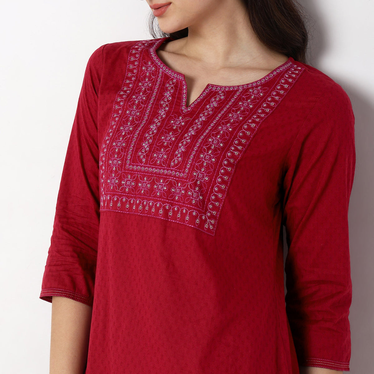 Women Wearing Straight Fit Solid Kurta