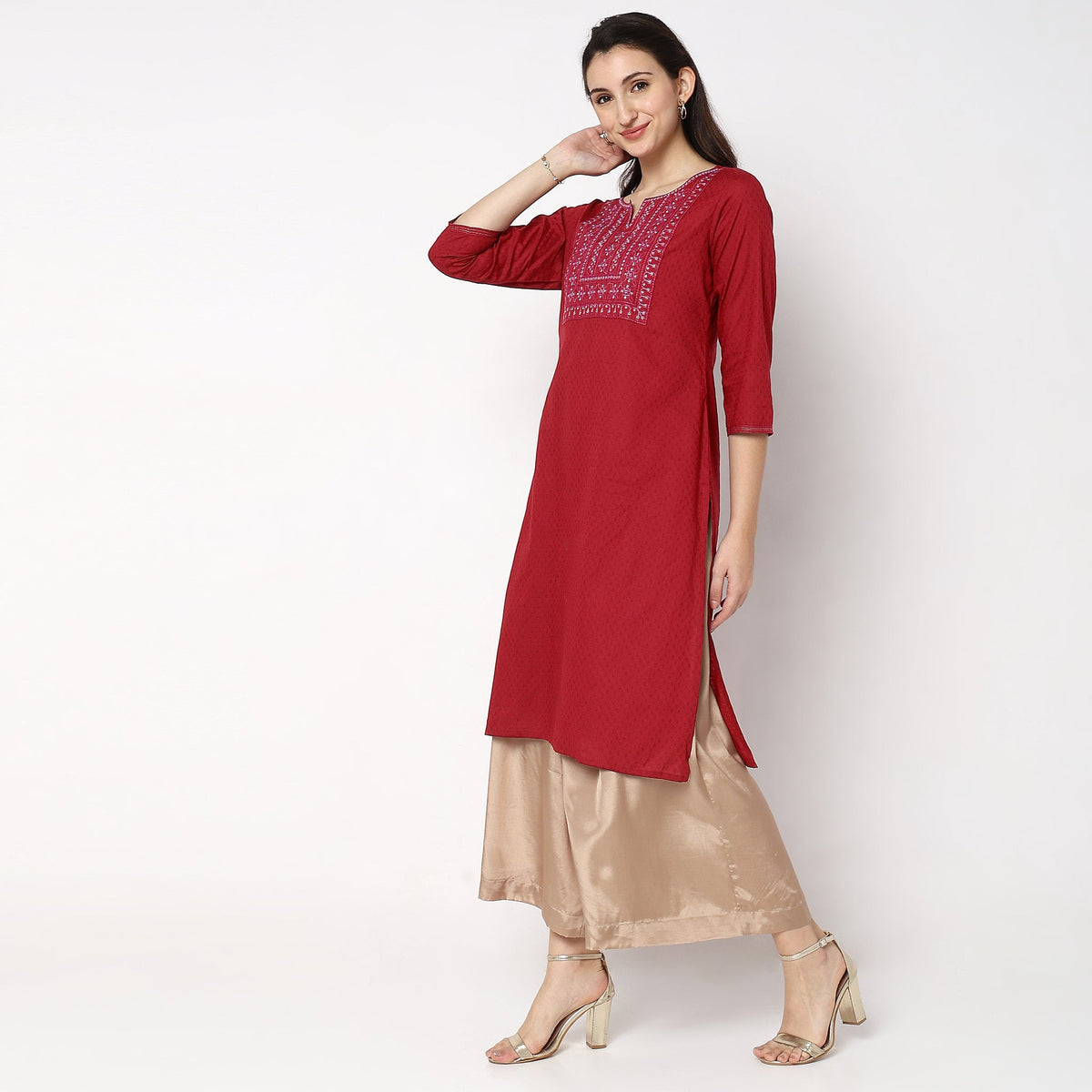 Women Wearing Straight Fit Solid Kurta