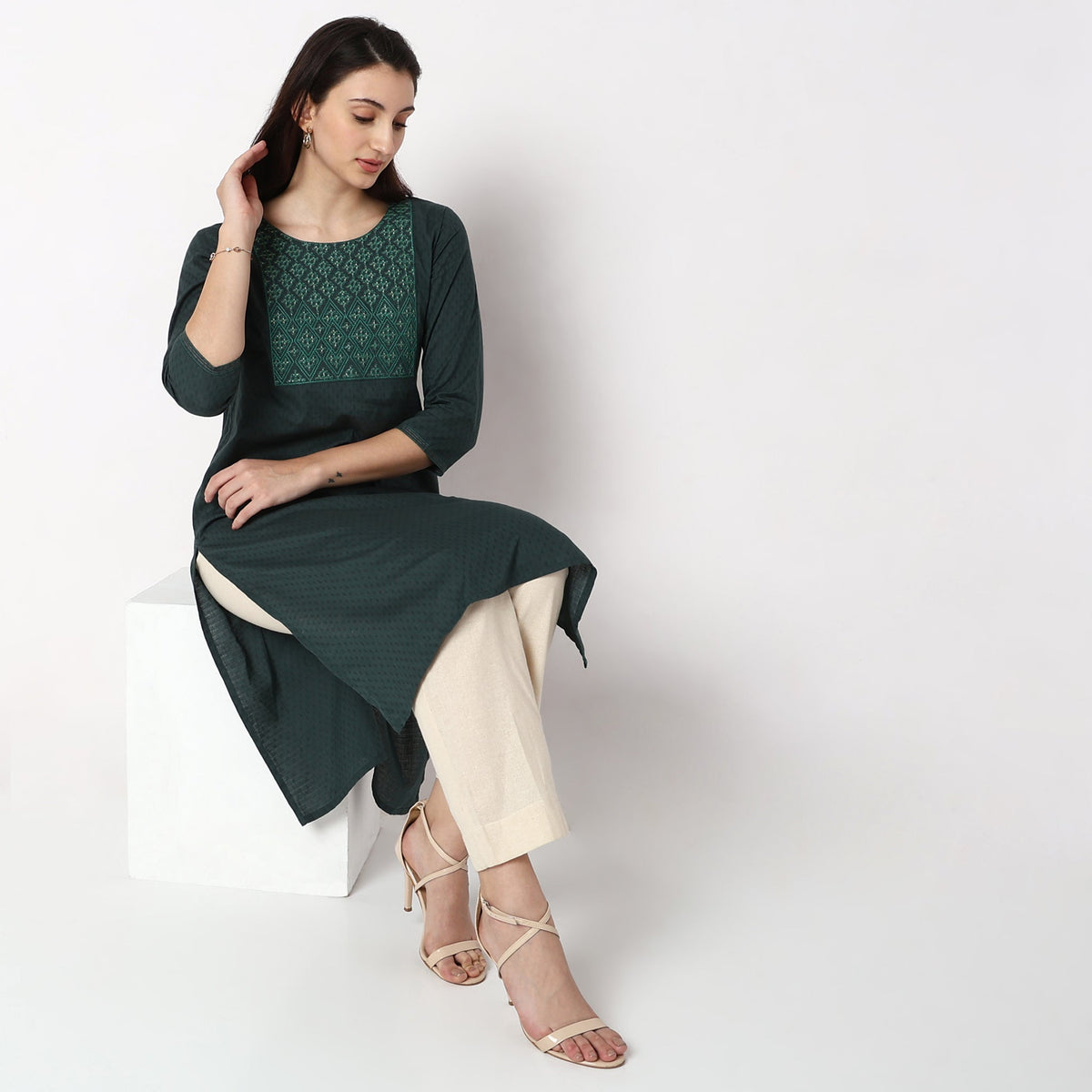 Women Wearing Straight Fit Solid Kurta