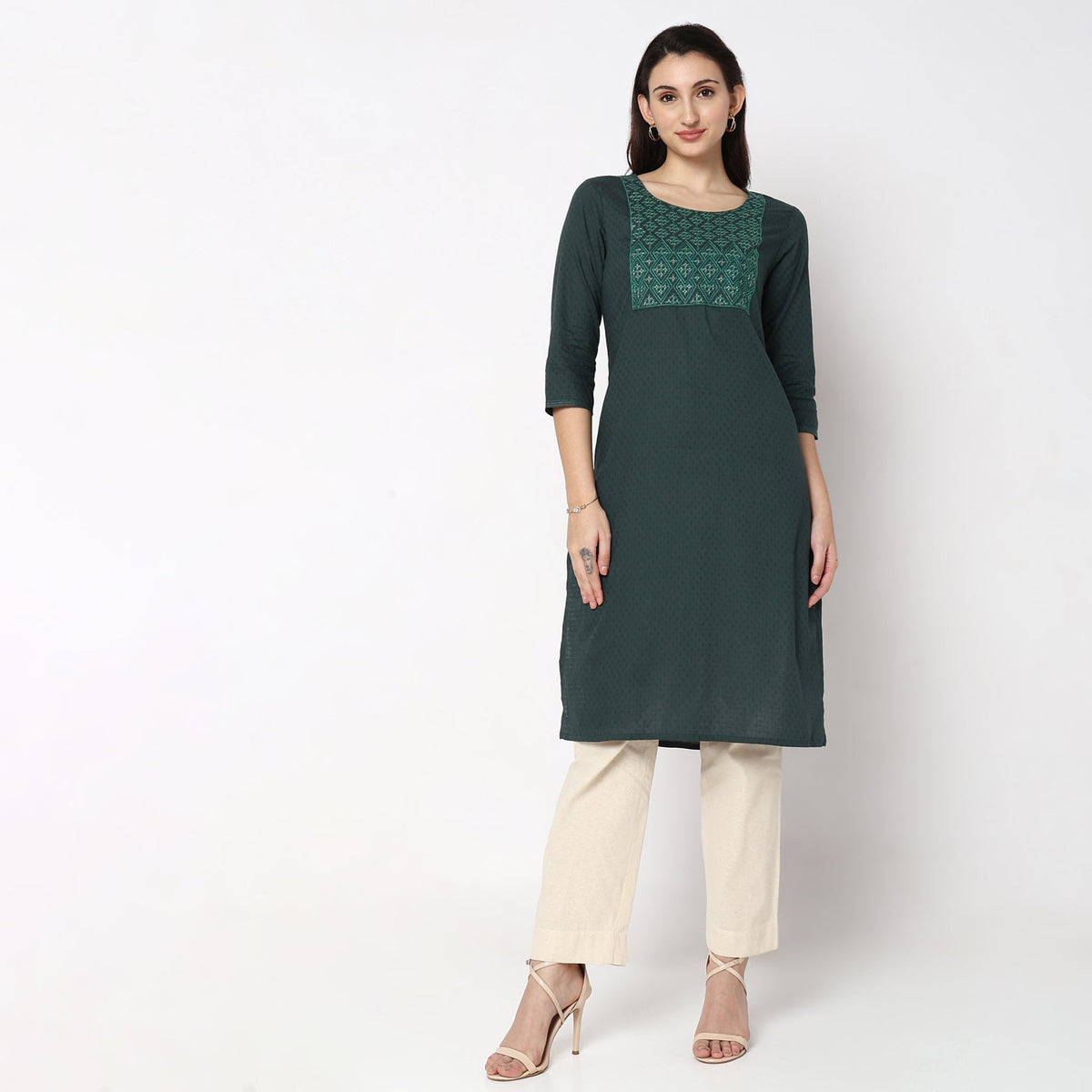 Women Wearing Straight Fit Solid Kurta