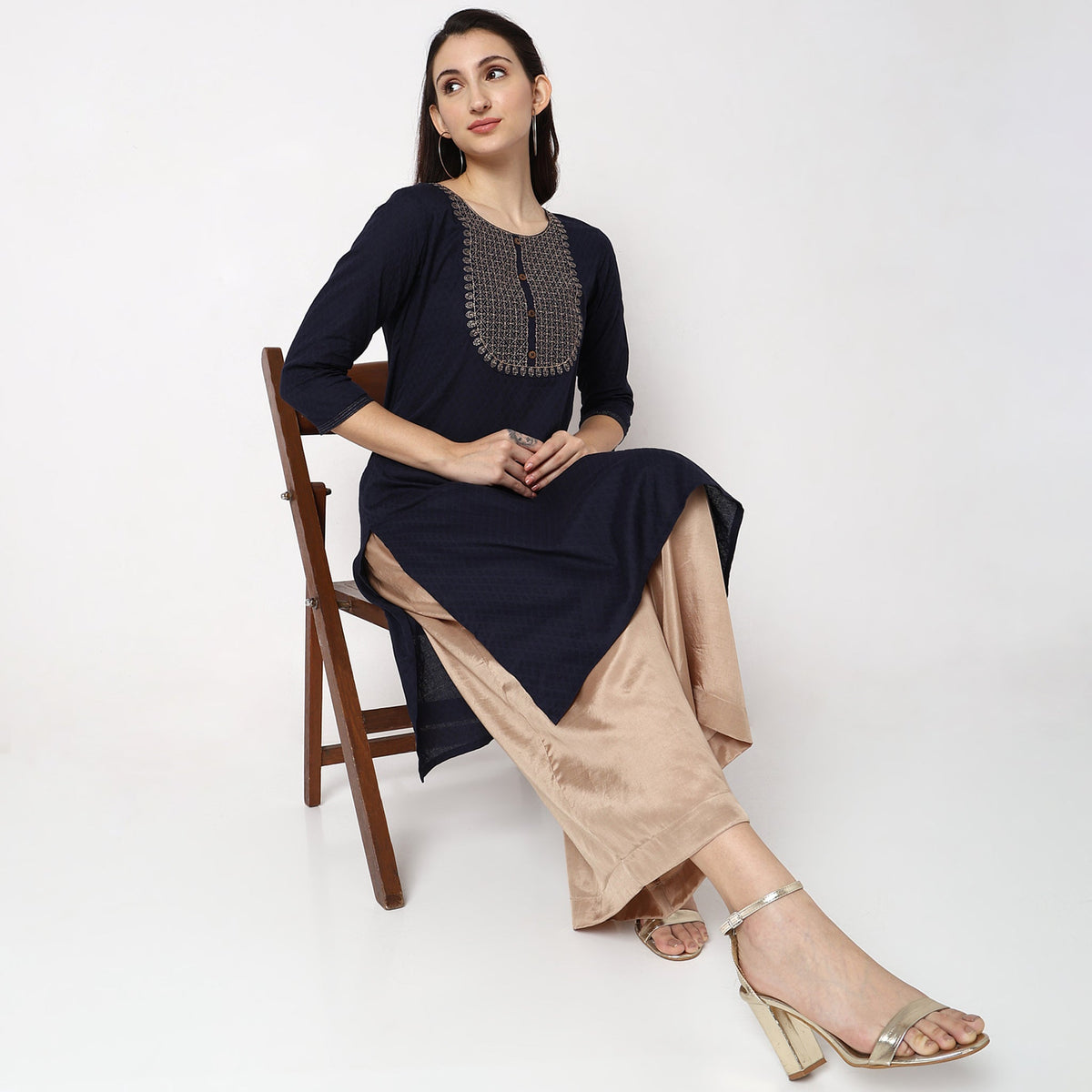 Women Wearing Straight Fit Solid Kurta