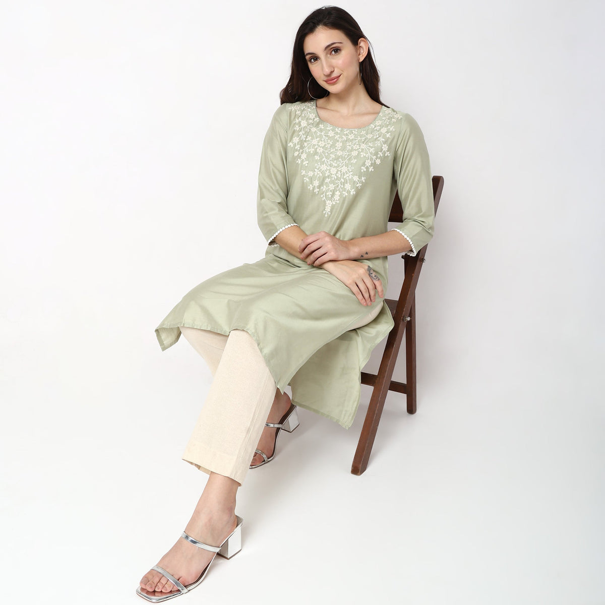 Women Wearing Straight Fit Embroidered Kurta