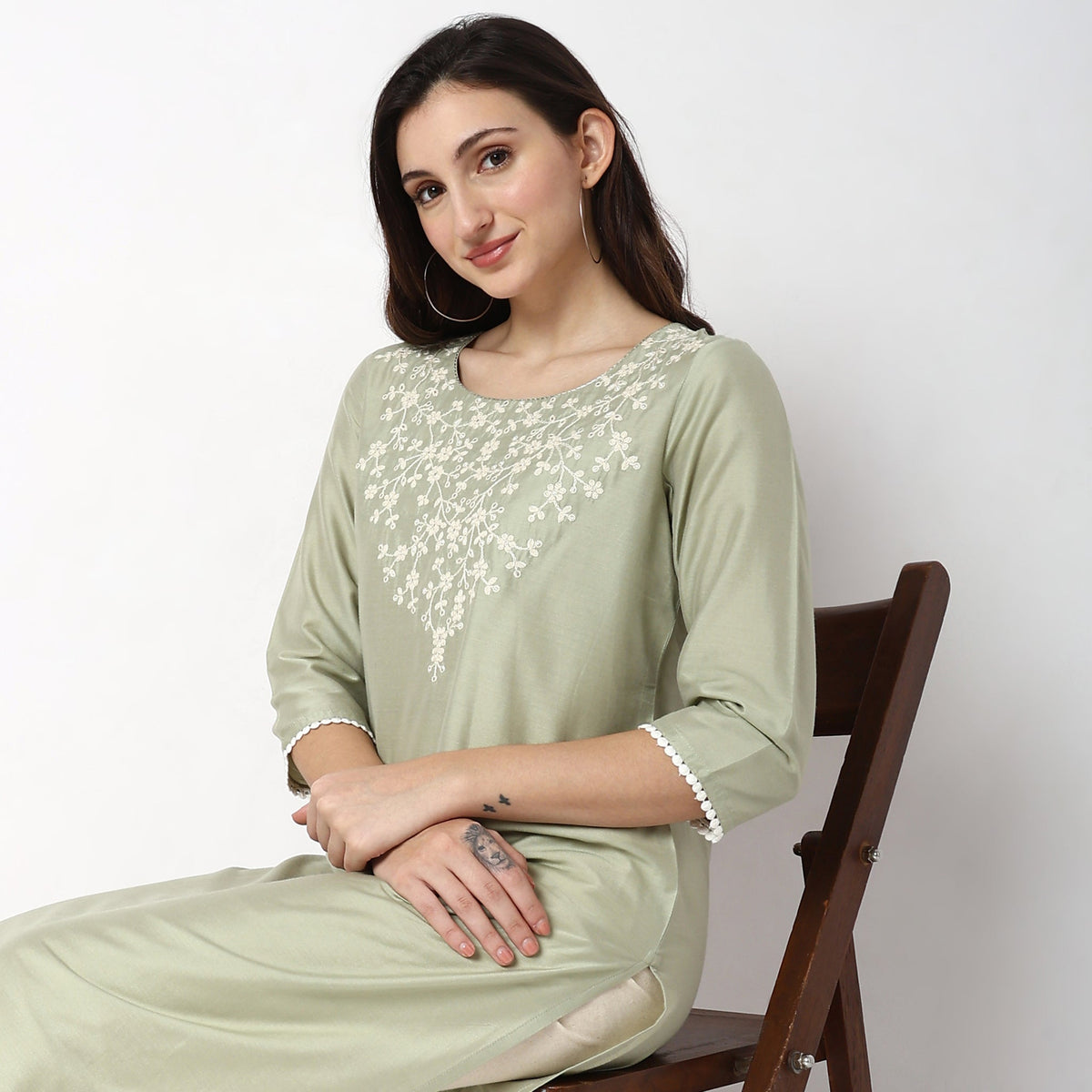 Women Wearing Straight Fit Embroidered Kurta