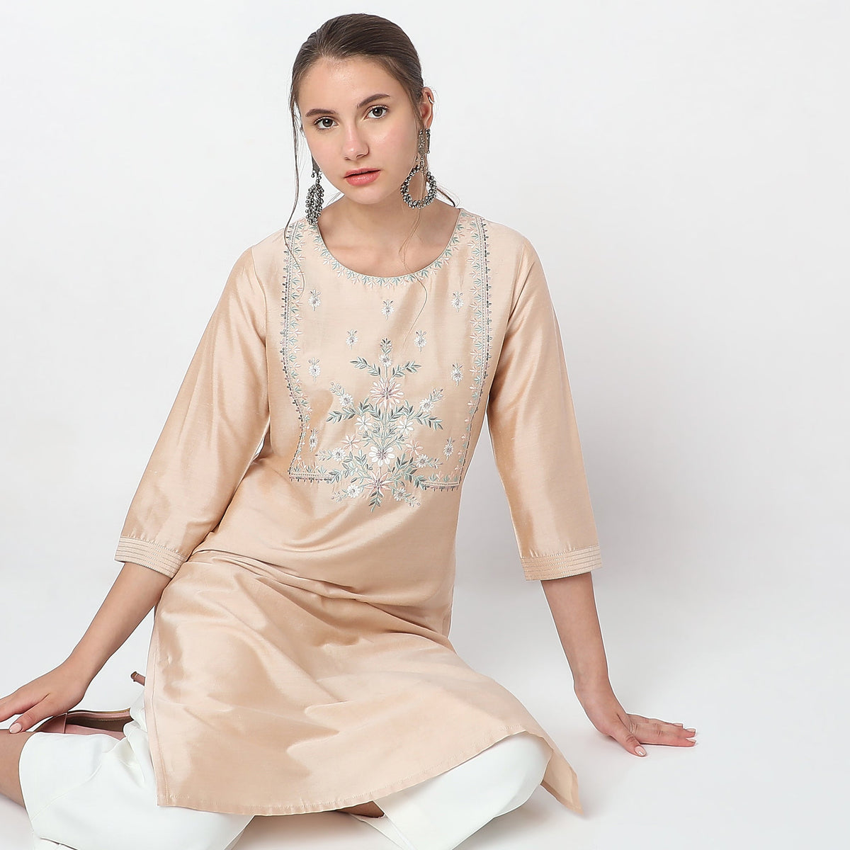 Women Wearing Straight Fit Embroidered Kurta