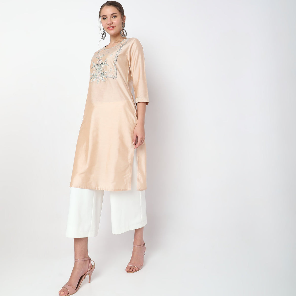 Women Wearing Straight Fit Embroidered Kurta