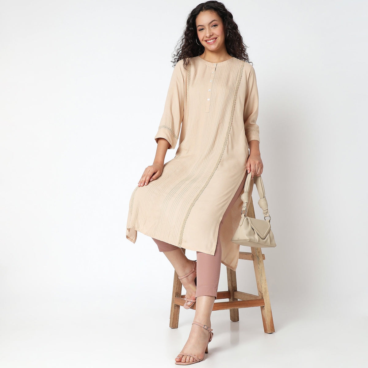 Women Wearing Straight Fit Solid Kurta