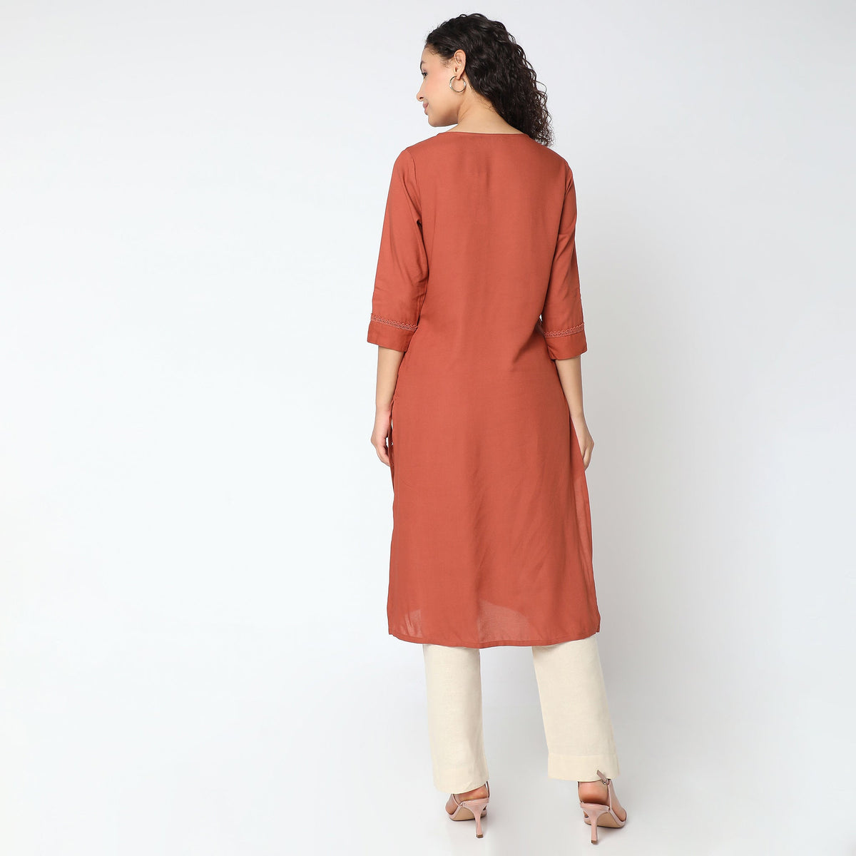 Women Wearing Straight Fit Solid Kurta