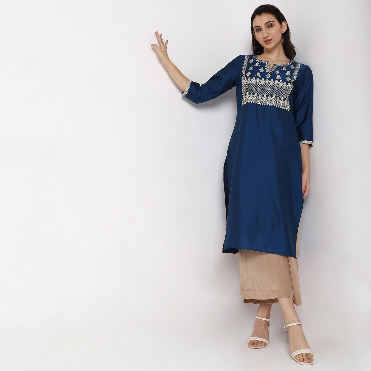 Women Wearing Straight Fit Embroidered Kurta