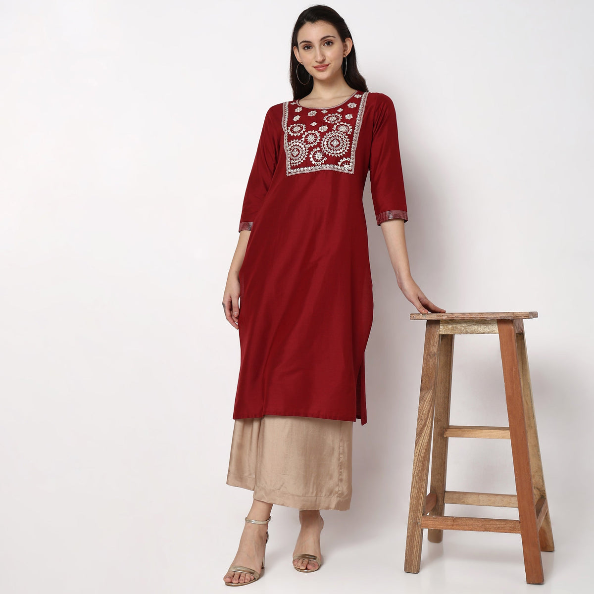 Women Wearing Straight Fit Embroidered Kurta