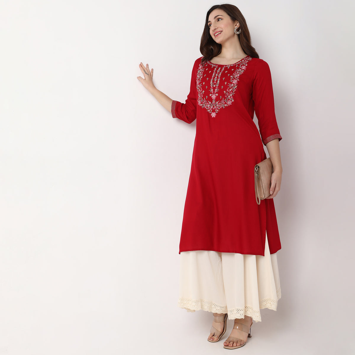 Women Wearing Straight Fit Embroidered Kurta