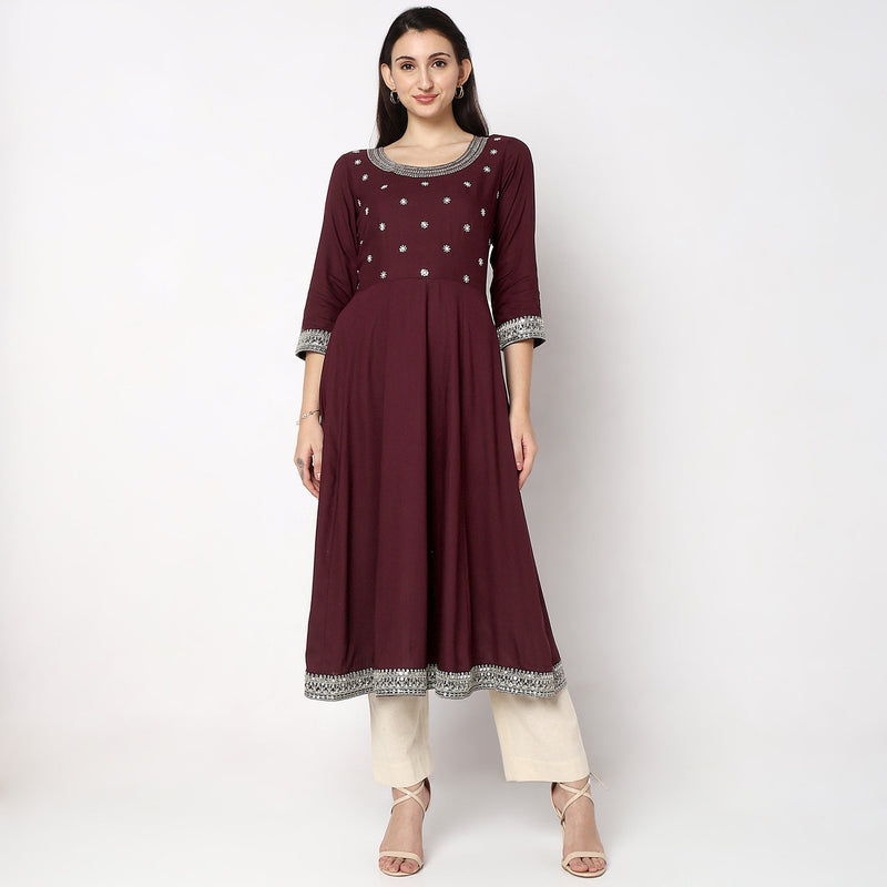 Women Wearing Flare Fit Embroidered Kurta