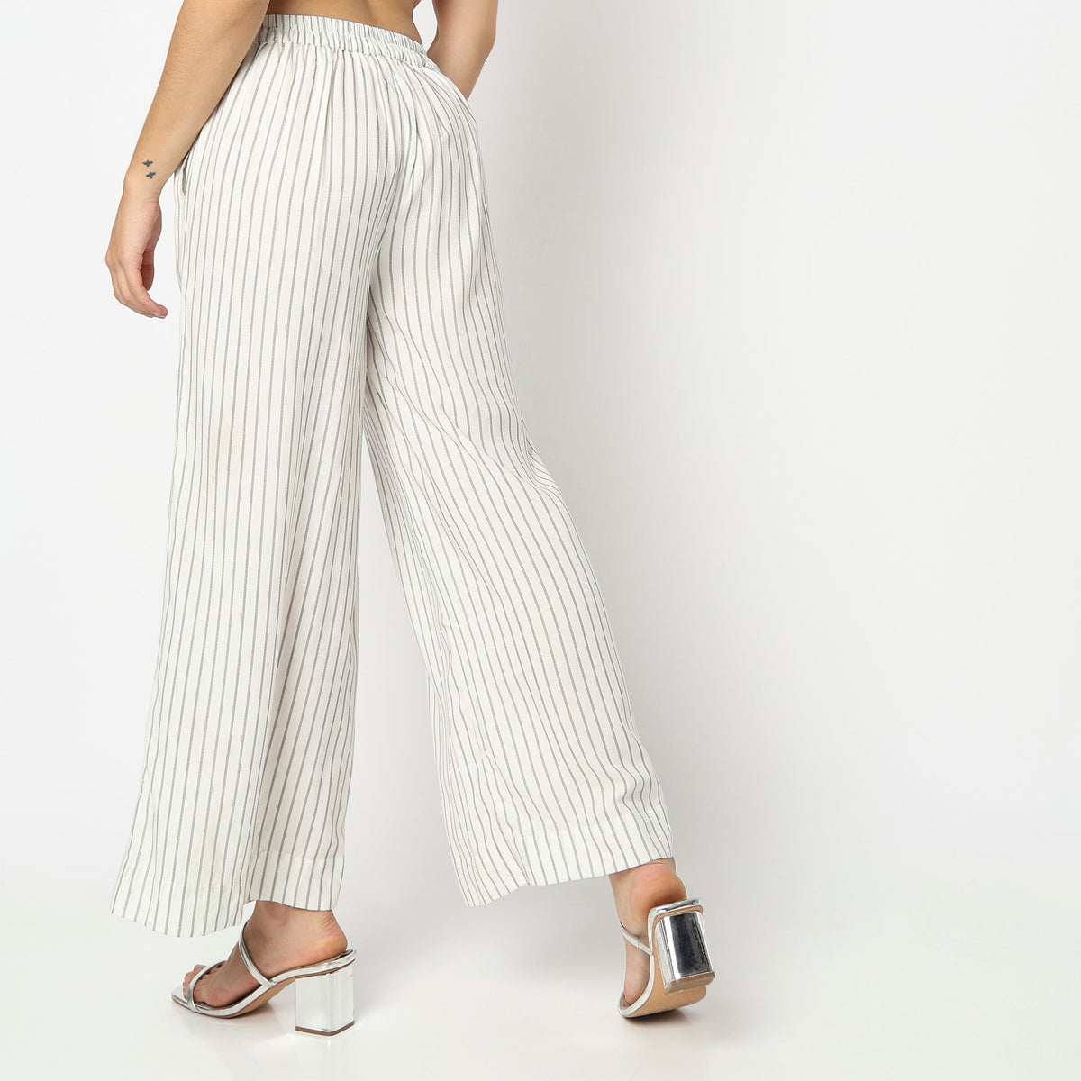 Women Wearing Flare Fit Striped High Rise Palazzo