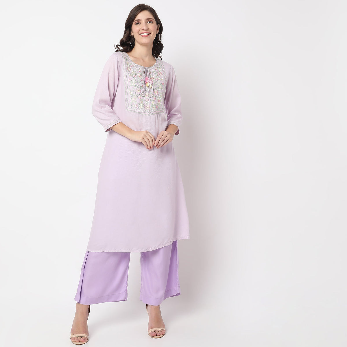 Women Wearing Straight Fit Embroidered Kurta