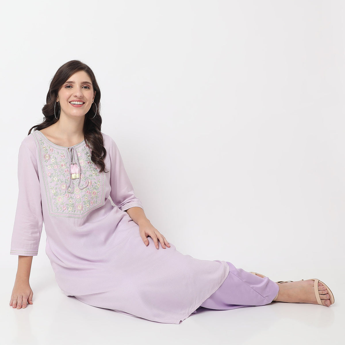 Women Wearing Straight Fit Embroidered Kurta