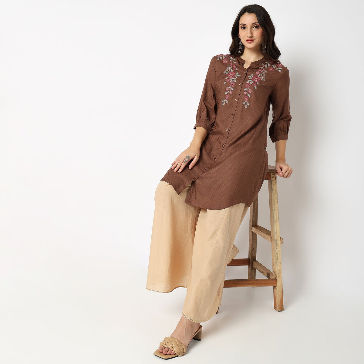 Women Wearing Regular Fit Embroidered Kurta