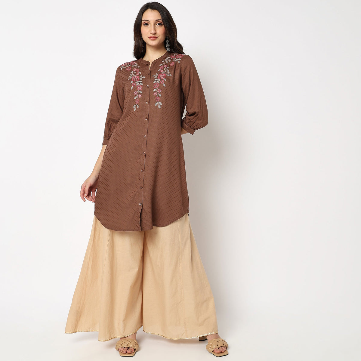 Women Wearing Regular Fit Embroidered Kurta