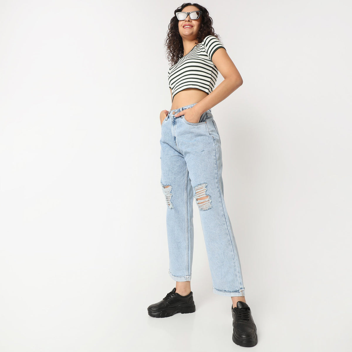 Women Wearing Straight Fit Distressed High Rise Jean