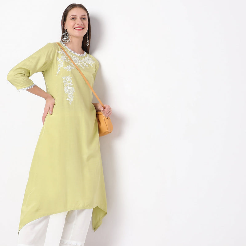 Women Wearing Straight Fit Embroidered Kurta