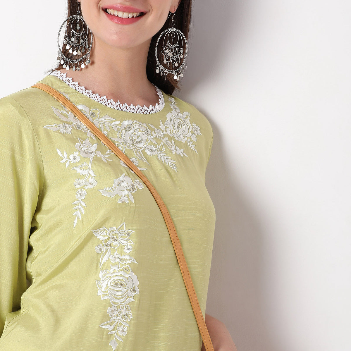 Women Wearing Straight Fit Embroidered Kurta