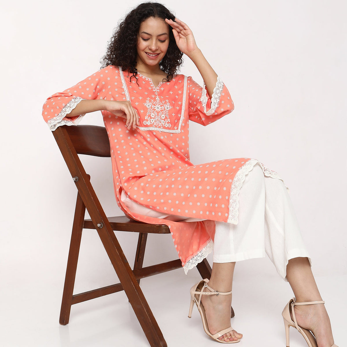 Women Wearing Straight Fit Embroidered Kurta