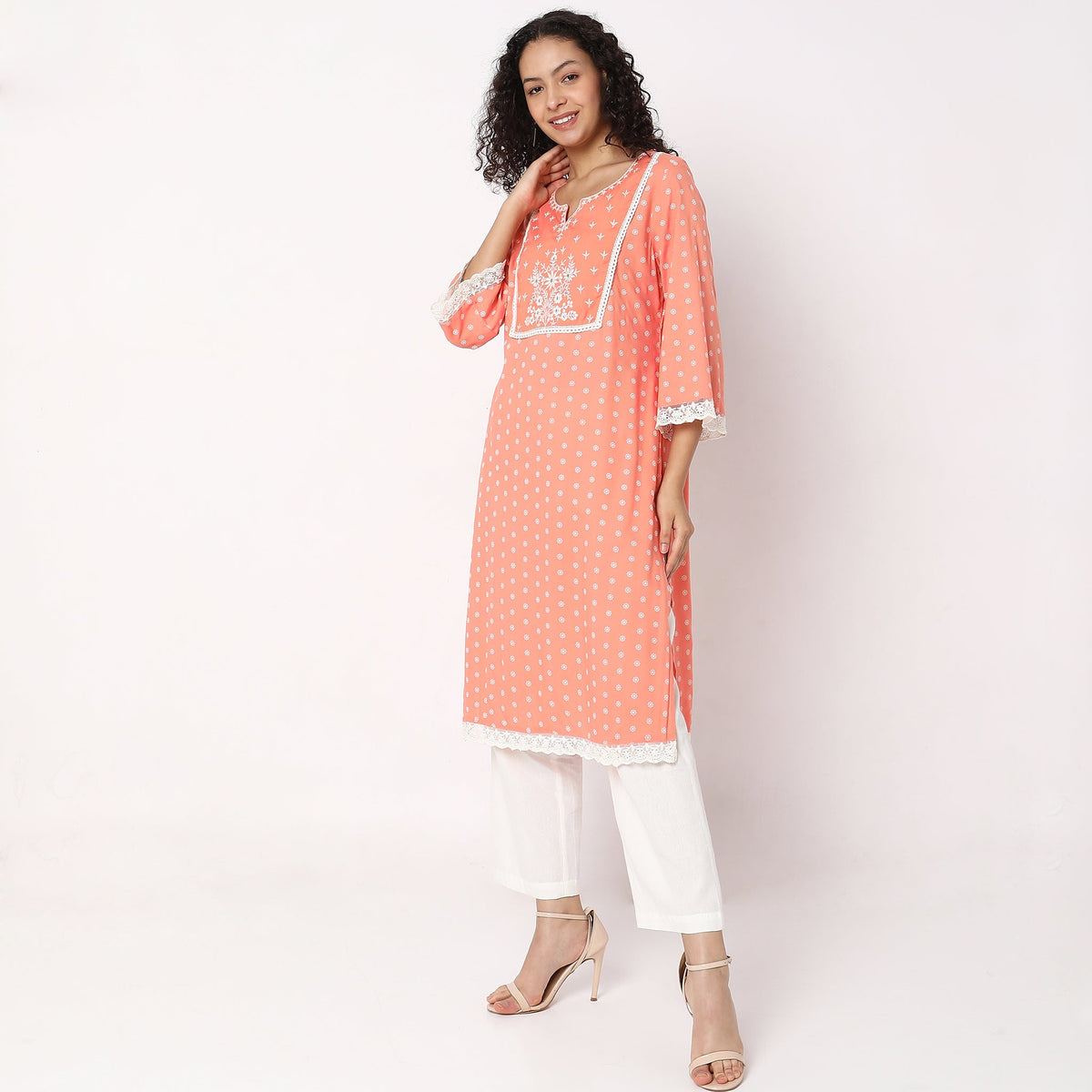 Women Wearing Straight Fit Embroidered Kurta