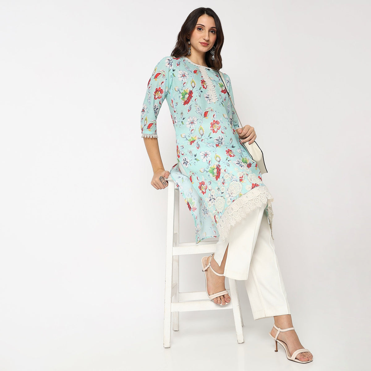 Women Wearing Straight Fit Solid Kurta