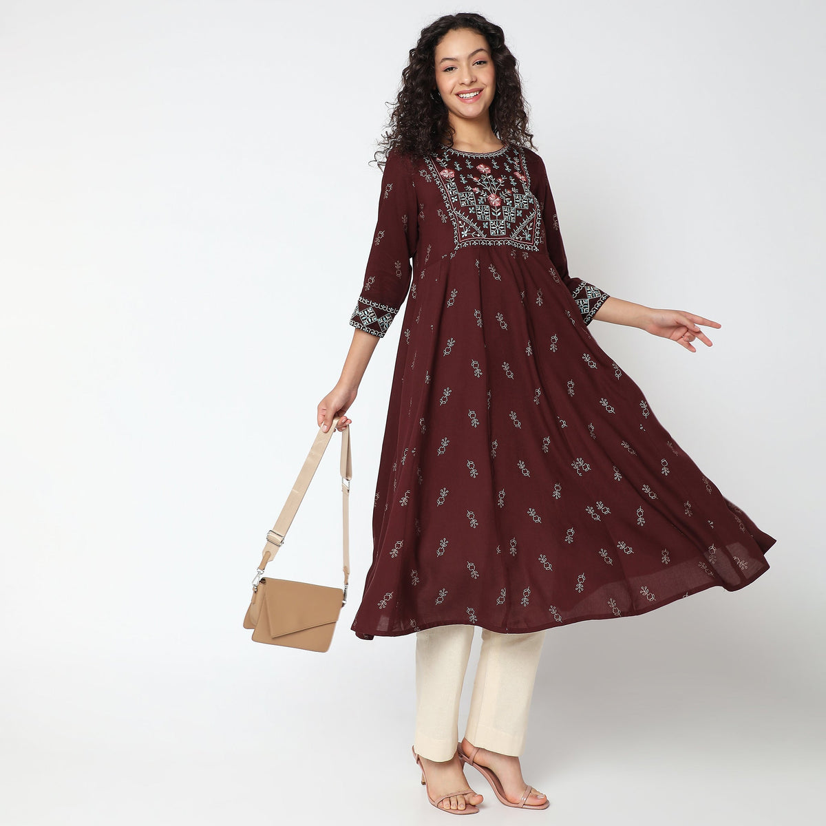 Women Wearing Flare Fit Embroidered Kurta